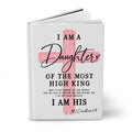 A hardcover book with a white cover featuring a pink painted cross and black text that reads, 'I AM A Daughter OF THE MOST HIGH KING' and 'I AM HIS' with a Bible verse below, shown on a white background.
